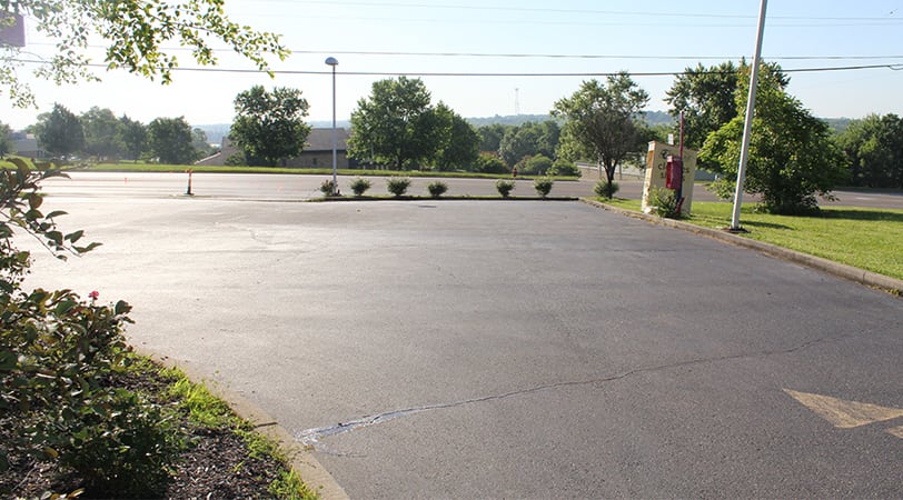 Newly coated parking lot with asphalt
